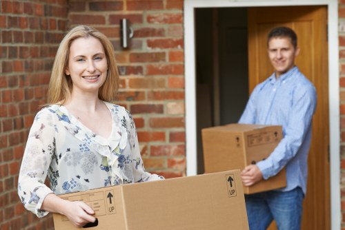 Careful removals team handling boxes and household items in Morden