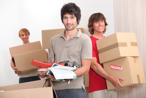 Careful furniture handling during a house relocation in Morden