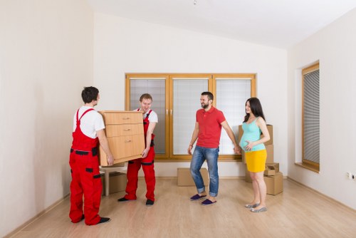 Professional movers handling stairs and bulky furniture