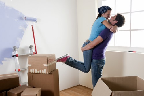 Loading furniture and boxes into a van for a move in Morden