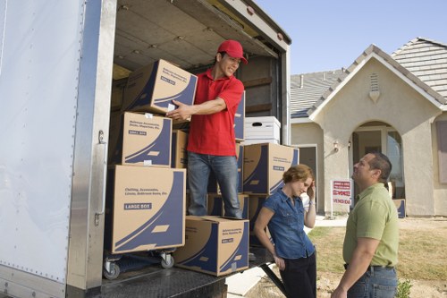 Furniture and boxes being loaded into a truck for a Morden move