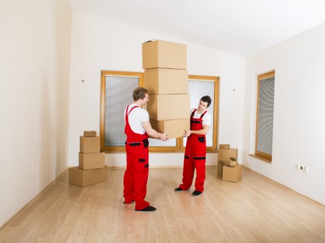 Local Morden moving service loading household items into a van